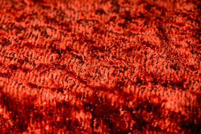 close up of velvety orange fabric