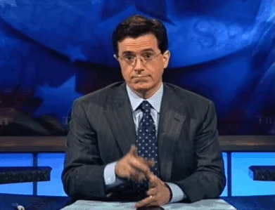 Colbert miming shush and locked lips